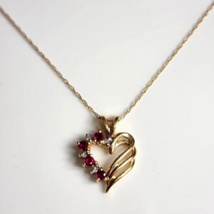 17″ 14KT Yellow Gold Necklace with Heart Shaped Pendant accented with Rubies and Diamonds