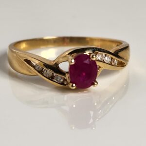 14KT Yellow Gold Ruby accented with Diamonds Womans Ring Size 7