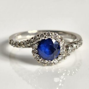 14KT White Gold Sapphire with a Halo of Diamonds Size 7