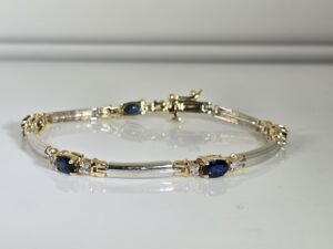 7" 14KT Two Toned Gold Bracelet with Oval Cut Sapphires and Diamond Accents