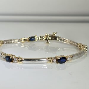 7″ 14KT Two Toned Gold Bracelet with Oval Cut Sapphires and Diamond Accents